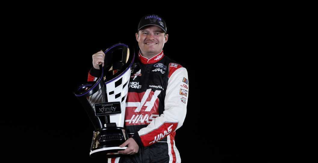 AVONDALE, ARIZONA - NOVEMBER 04: Cole Custer, driver of the #00 Haas Automation Ford, poses with the 2023 NASCAR Xfinity Series Championship trophy after winning the NASCAR Xfinity Series Championship at Phoenix Raceway on November 04, 2023 in Avondale, Arizona.