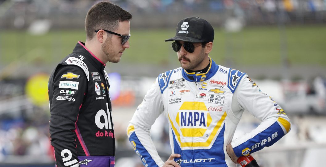 MARTINSVILLE, VIRGINIA - APRIL 16: Alex Bowman, driver of the #48 Ally Chevrolet, (L) and Chase Elliott, driver of the #9 NAPA Auto Parts Chevrolet, talk backstage during pre-race ceremonies prior to the NASCAR Cup Series NOCO 400 at Martinsville Speedway on April 16, 2023 in Martinsville, Virginia.