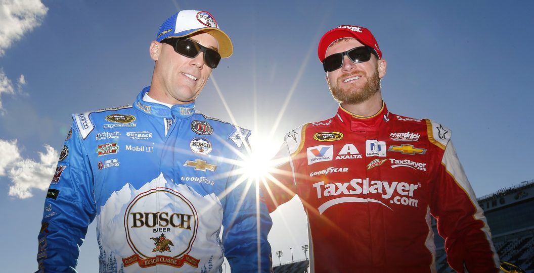 DAYTONA BEACH, FL - FEBRUARY 12: Kevin Harvick, driver of the #4 Busch Beer Chevrolet, and Dale Earnhardt Jr., driver of the #88 Taxslayer.com Chevrolet, walk through the garage area during practice for the NASCAR Sprint Cup Series Sprint Unlimited at Daytona International Speedway on February 12, 2016 in Daytona Beach, Florida.