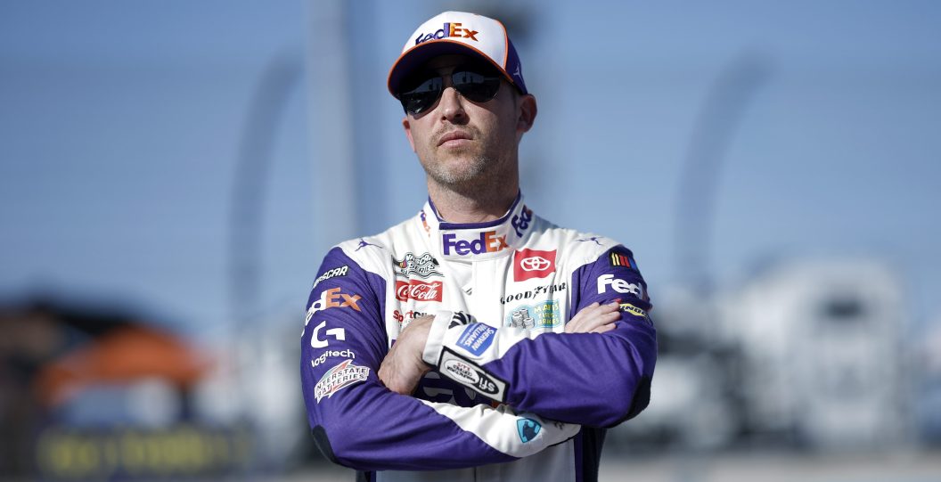 AVONDALE, ARIZONA - NOVEMBER 04: Denny Hamlin, driver of the #11 FedEx Toyota, looks on during qualifying for the NASCAR Cup Series Championship at Phoenix Raceway on November 04, 2023 in Avondale, Arizona.