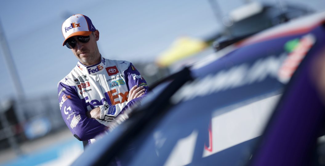 AVONDALE, ARIZONA - NOVEMBER 04: Denny Hamlin, driver of the #11 FedEx Toyota, waits on the grid during qualifying for the NASCAR Cup Series Championship at Phoenix Raceway on November 04, 2023 in Avondale, Arizona.