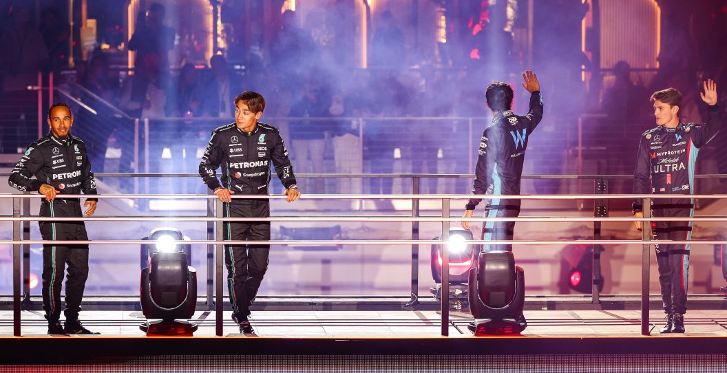 LAS VEGAS, NEVADA - NOVEMBER 15: (L-R) Lewis Hamilton of Great Britain and Mercedes, George Russell of Great Britain and Mercedes, Alex Albon of Thailand and Williams F1 and Logan Sargeant of United States and Williams greet the fans at the Las Vegas GP launch party during previews ahead of the F1 Grand Prix of Las Vegas at Las Vegas Strip Circuit on November 15, 2023 in Las Vegas, United States.