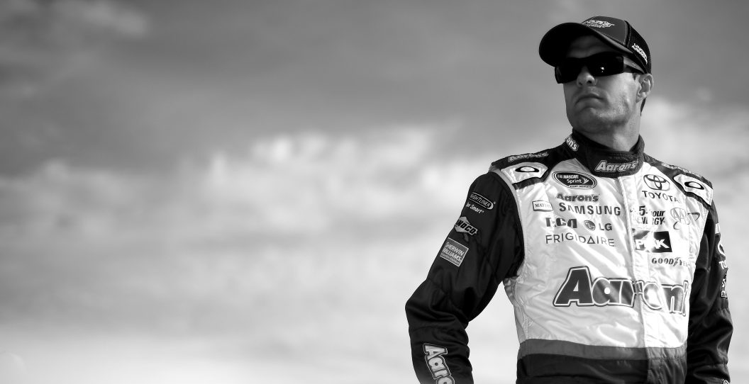 LOUDON, NH - SEPTEMBER 25: (EDITOR'S NOTE: Image was processed using digital filters.) David Ragan, driver of the #55 Aaron's Dream Machine Toyota, stands on the grid during qualifying for the NASCAR Sprint Cup Series Sylvania 300 at New Hampshire Motor Speedway on September 25, 2015 in Loudon, New Hampshire.