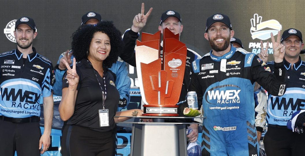 AVONDALE, ARIZONA - NOVEMBER 05: Ross Chastain, driver of the #1 Worldwide Express Chevrolet, and Latasha Causey, president of Phoenix Raceway pose for photos in victory lane after winning the NASCAR Cup Series Championship race at Phoenix Raceway on November 05, 2023 in Avondale, Arizona.