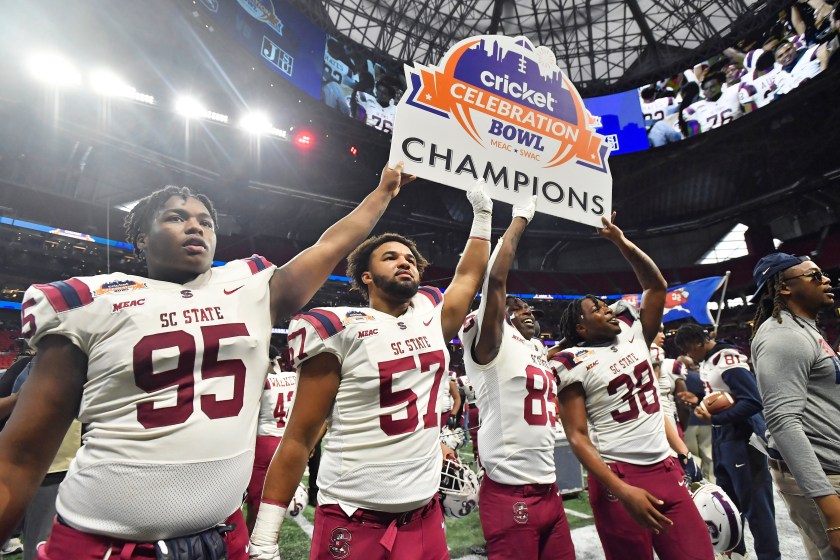 South Carolina State players hold up a Celebration Bowl sign.