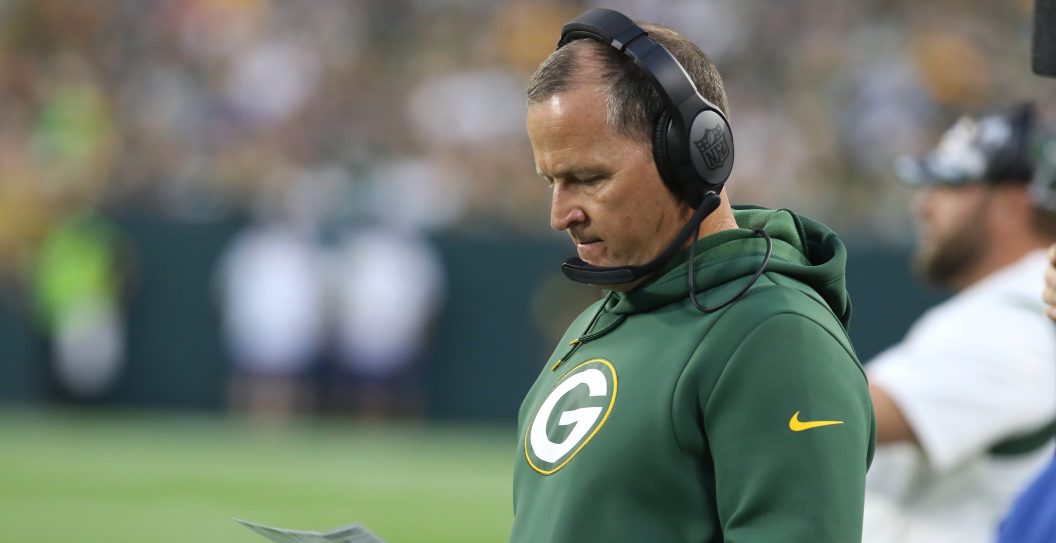 GREEN BAY, WI - AUGUST 19: Green Bay Packers defensive coordinator Joe Barry looks at his play sheet during an NFL preseason game between the Green Bay Packers and the New Orleans Saints on August 19, 2022, at Lambeau Field in Green Bay, WI.