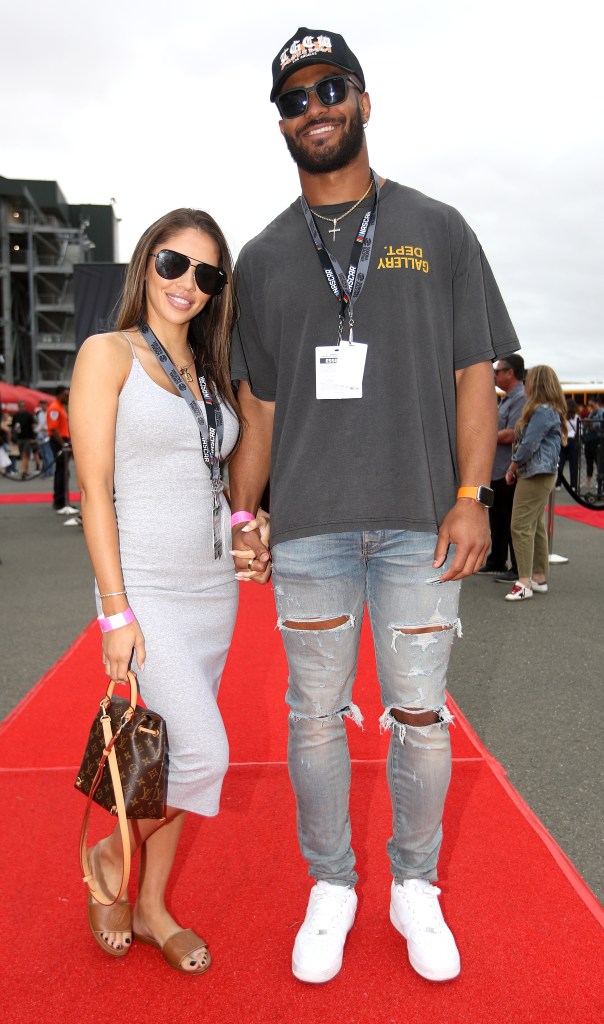 SONOMA, CALIFORNIA - JUNE 12: Fred Warner, linebacker for the San Francisco 49ers and Sydney Hightower pose for photos on the red carpet prior to the NASCAR Cup Series Toyota/Save Mart 350 at Sonoma Raceway on June 12, 2022 in Sonoma, California. 