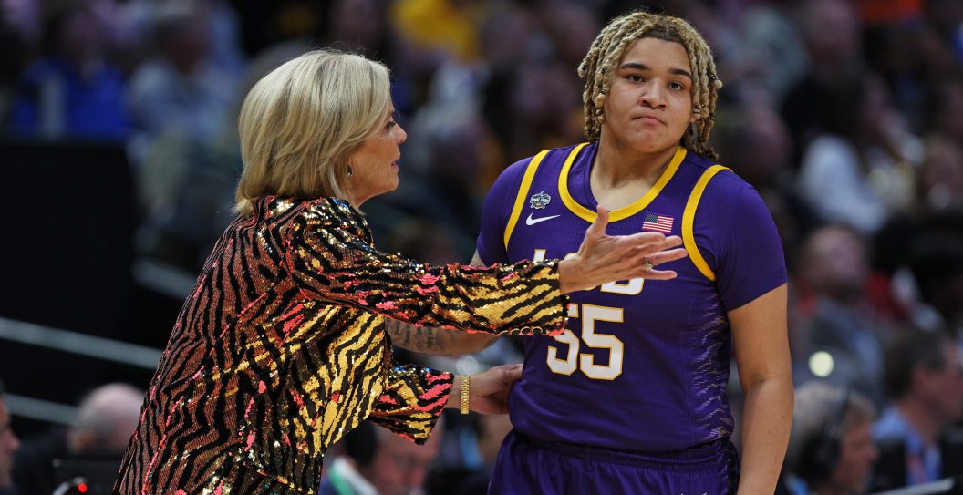 DALLAS, TEXAS - APRIL 02: Head coach Kim Mulkey of the LSU Lady Tigers talks with Kateri Poole #55 during the first quarter against the Iowa Hawkeyes during the 2023 NCAA Women's Basketball Tournament championship game at American Airlines Center on April 02, 2023 in Dallas, Texas.