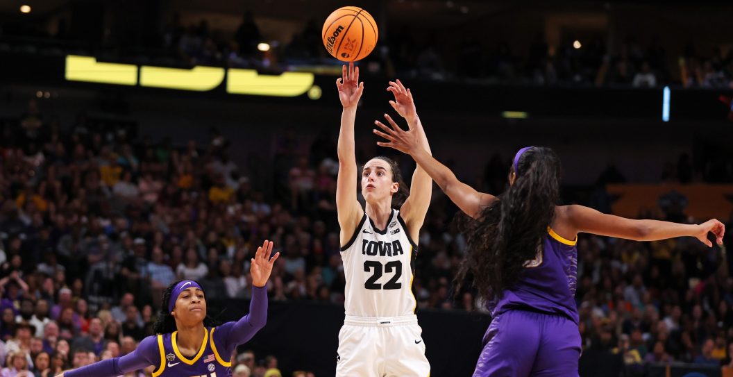 DALLAS, TEXAS - APRIL 02: Caitlin Clark #22 of the Iowa Hawkeyes shoots the ball against Angel Reese #10 of the LSU Lady Tigers during the fourth quarter during the 2023 NCAA Women's Basketball Tournament championship game at American Airlines Center on April 02, 2023 in Dallas, Texas.