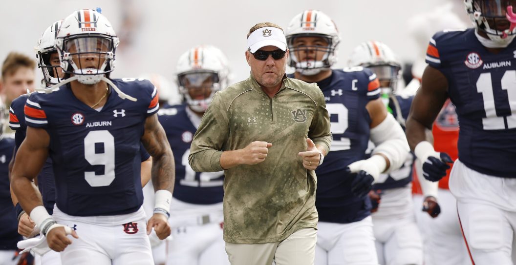 AUBURN, ALABAMA - OCTOBER 28: Head coach Hugh Freeze of the Auburn Tigers leads the team onto the field prior to a game against the Mississippi State Bulldogs at Jordan-Hare Stadium on October 28, 2023 in Auburn, Alabama.
