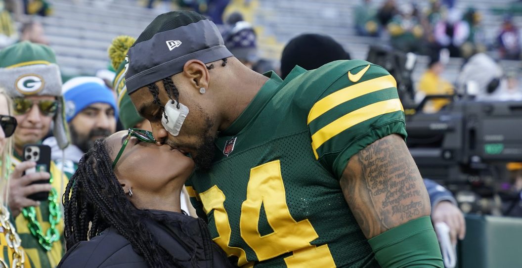 GREEN BAY, WISCONSIN - NOVEMBER 19: Jonathan Owens #34 of the Green Bay Packers kisses wife Simone Biles before the game against the Los Angeles Chargers at Lambeau Field on November 19, 2023 in Green Bay, Wisconsin.