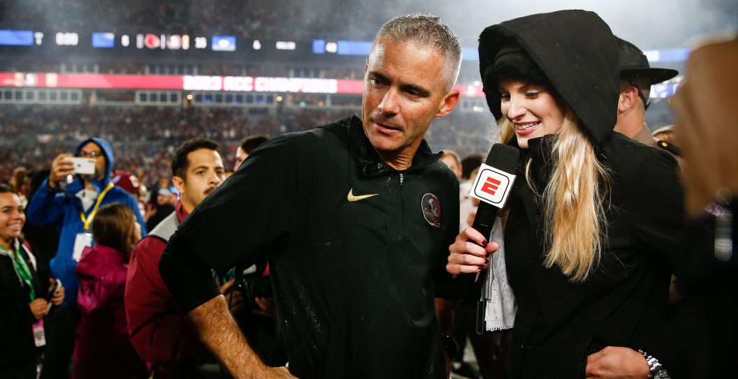 CHARLOTTE, NORTH CAROLINA - DECEMBER 2: Katie George of ESPN interviews Head coach Mike Norvell of the Florida State Seminoles after the Florida State Seminoles defeat the Louisville Cardinals during the ACC Championship at Bank of America Stadium on December 2, 2023 in Charlotte, North Carolina.