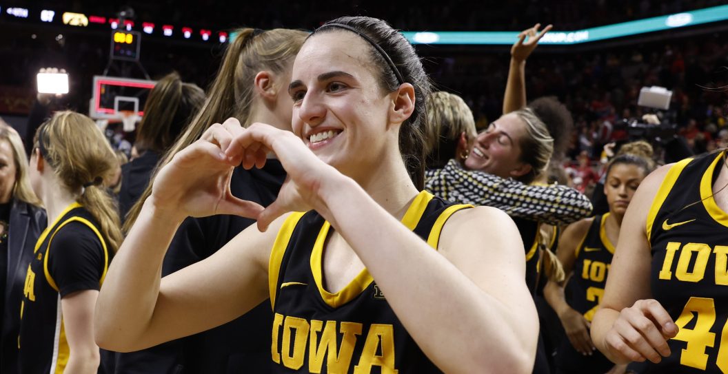 AMES, IA - DECEMBER 6: Caitlin Clark #22 of the Iowa Hawkeyes celebrates a 67-58 win over the Iowa State Cyclones at Hilton Coliseum on December 6, 2023 in Ames, Iowa. Clark became the 15th player in Division I women's basketball history to reach 3,000 career points in the game.