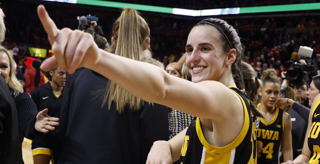 AMES, IA - DECEMBER 6: Caitlin Clark #22 of the Iowa Hawkeyes reacts after the Iowa Hawkeyes won 67-58 over the Iowa State Cyclones. Clark became the 15th player in Division I women's basketball history to reach 3,000 points for her career when she broke 3,000 points with a three point basket in the game at Hilton Coliseum on December 6, 2023 in Ames, Iowa. They Iowa Hawkeyes won 67-58 over the Iowa State Cyclones.