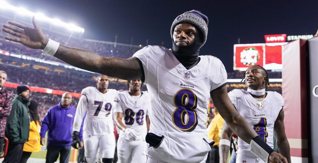 SANTA CLARA, CALIFORNIA - DECEMBER 25: Lamar Jackson #8 of the Baltimore Ravens high fives a fan while heading into the locker room after the first half against the San Francisco 49ers at Levi's Stadium on December 25, 2023 in Santa Clara, California.
