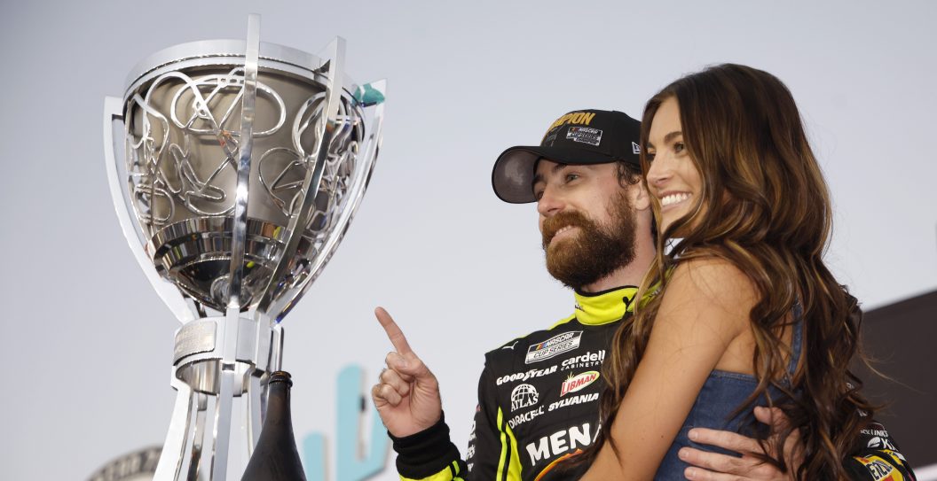 AVONDALE, ARIZONA - NOVEMBER 05: Ryan Blaney, driver of the #12 Menards/Dutch Boy Ford, and Gianna Tulio pose for photos in victory lane after winning the 2023 NASCAR Cup Series Championship, finishing first of the Championship 4 drivers in the NASCAR Cup Series Championship race at Phoenix Raceway on November 05, 2023 in Avondale, Arizona.