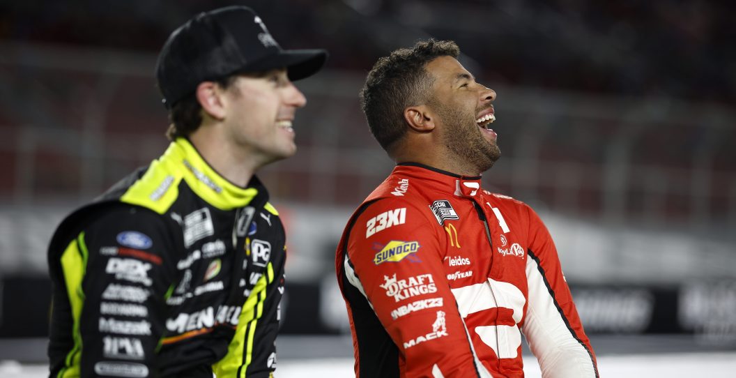 LOS ANGELES, CALIFORNIA - FEBRUARY 04: Bubba Wallace, driver of the #23 DoorDash Toyota, shares a laugh with Ryan Blaney, driver of the #12 Menards/Great Lakes Flooring Ford, during qualifying for the NASCAR Clash at the Coliseum at Los Angeles Coliseum on February 04, 2023 in Los Angeles, California.