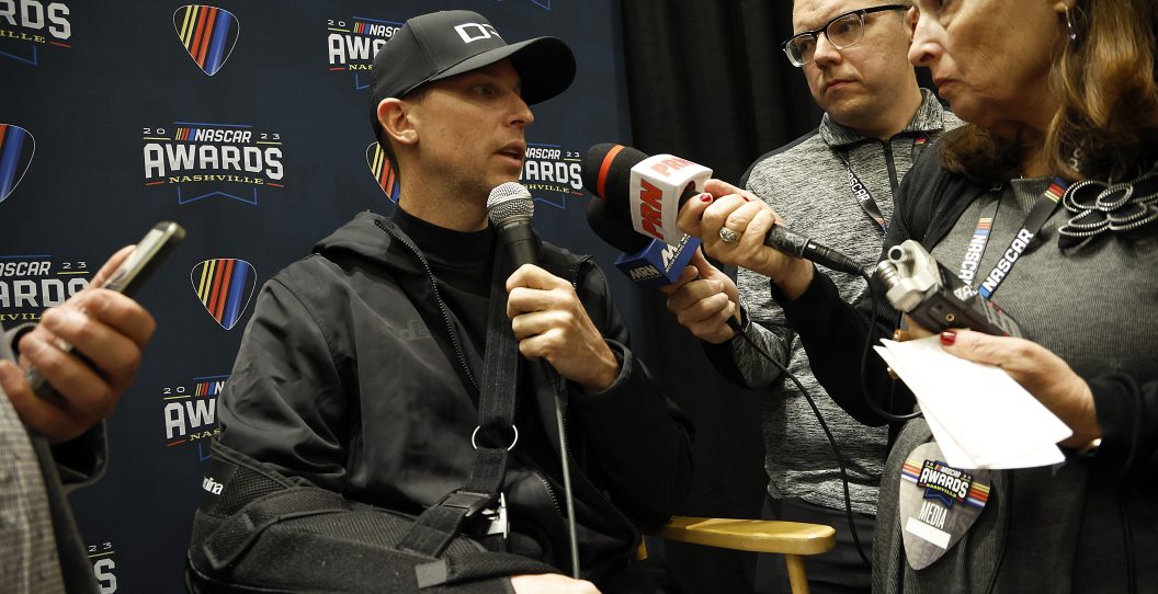 NASHVILLE, TENNESSEE - NOVEMBER 30: NASCAR Cup Series driver, Denny Hamlin speaks to the media during the media scrum at Music City Center on November 30, 2023 in Nashville, Tennessee.