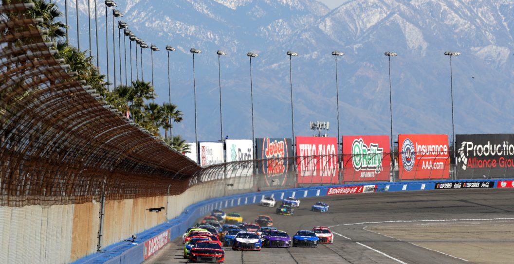 FONTANA, CALIFORNIA - FEBRUARY 27: A general view of racing during the NASCAR Cup Series Wise Power 400 at Auto Club Speedway on February 27, 2022 in Fontana, California.