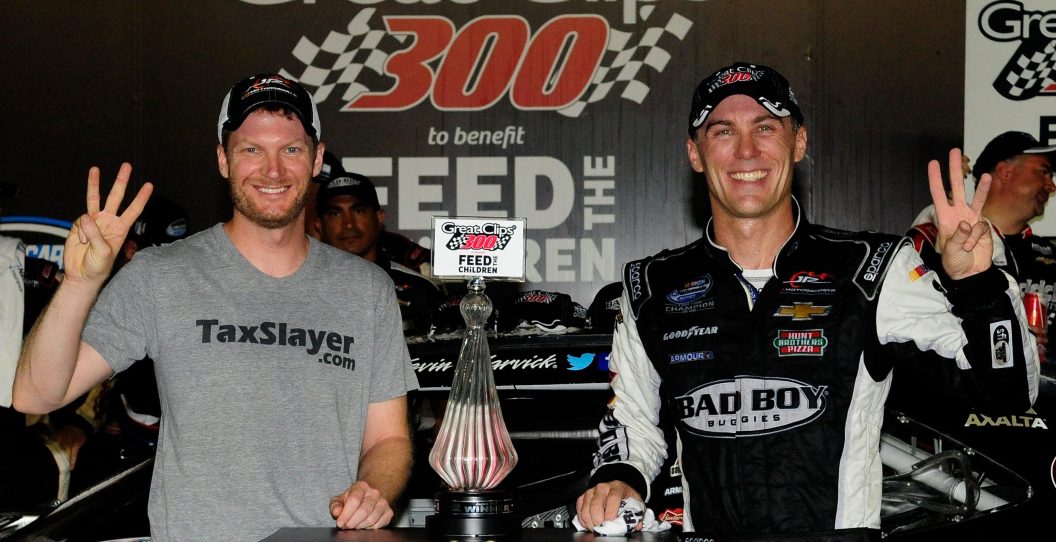 HAMPTON, GA - AUGUST 30: Kevin Harvick, driver of the #5 Bad Boy Buggies Chevrolet, and Dale Earnhardt Jr., owner of Jr. Motorsports, pose with the trophy in Victory Lane after winning the NASCAR Nationwide Series Great Clips 300 at Atlanta Motor Speedway on August 30, 2014 in Hampton, Georgia.