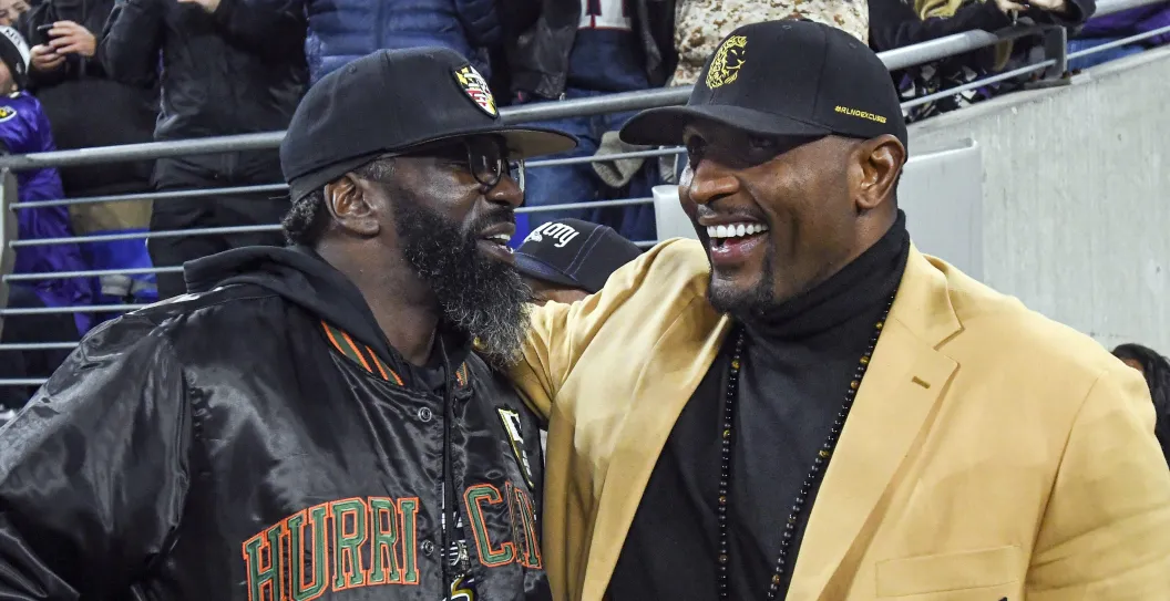 BALTIMORE, MD - NOVEMBER 03: Baltimore Ravens great Ed Reed (L) greets Hall of Fame member Ray Lewis (R) during the game between the New England Patriots and the Baltimore Ravens on November 3, 2019, at M&T Bank Stadium in Baltimore, MD.
