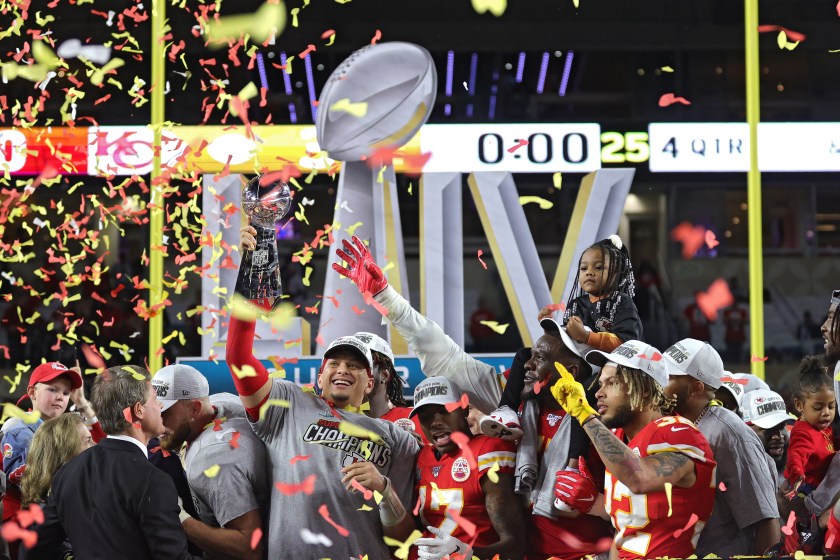 Patrick Mahomes holds up the Lombardi Trophy at Super Bowl LIV.
