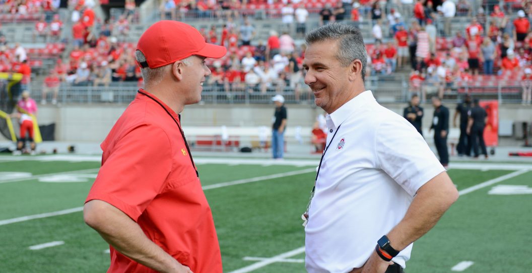 COLUMBUS, OH - OCTOBER 07: Head coach D.J. Durkin of the Maryland Terrapins talks with head coach Urban Meyer of the Ohio State Buckeyes before the game at Ohio Stadium on October 7, 2017 in Columbus, Ohio.