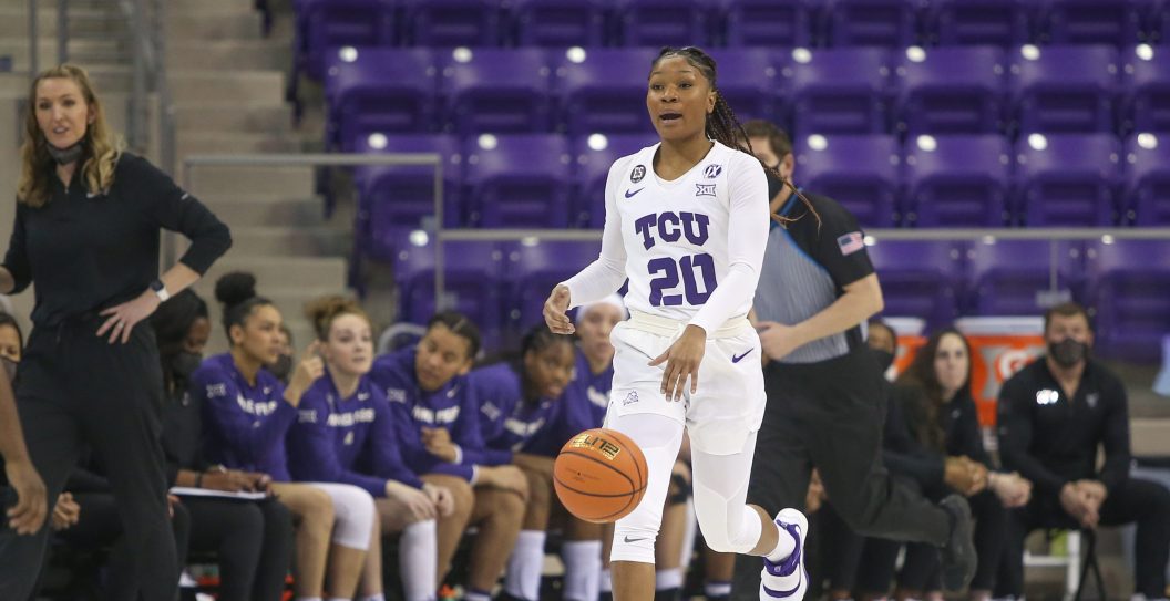FORT WORTH, TX - FEBRUARY 02: TCU Horned Frogs guard Lauren Heard (20) brings the ball up court during the game between TCU and West Virginia on February 2, 2022 at Ed & Rae Schollmaier Arena in Fort Worth, TX.