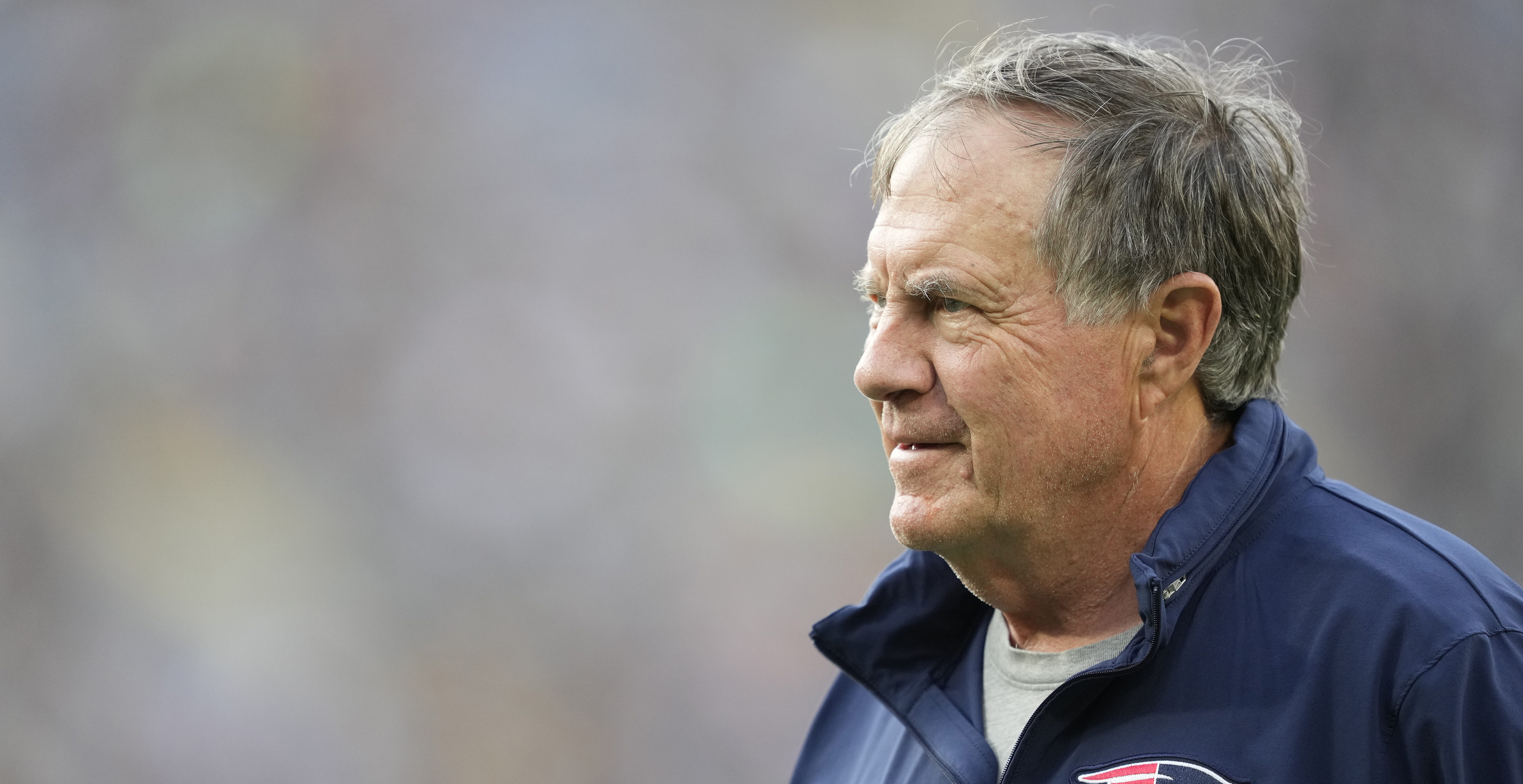 GREEN BAY, WISCONSIN - AUGUST 19: Head coach Bill Belichick of the New England Patriots looks on before a preseason game against the Green Bay Packers at Lambeau Field on August 19, 2023 in Green Bay, Wisconsin.