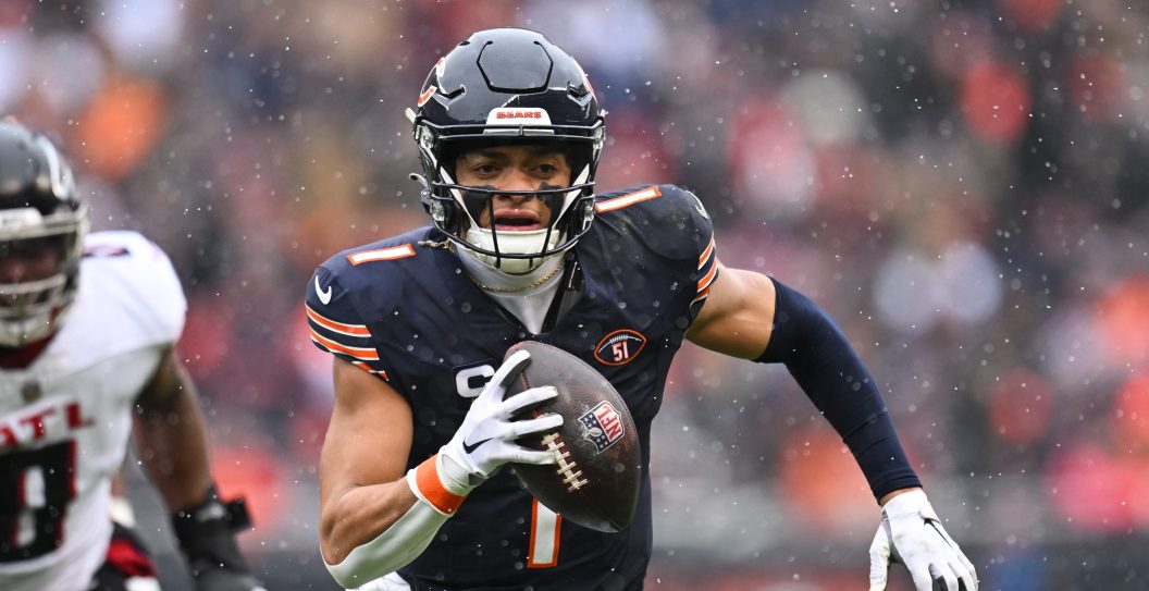 CHICAGO, ILLINOIS - DECEMBER 31: Justin Fields #1 of the Chicago Bears runs the ball during the first quarter against the Atlanta Falcons at Soldier Field on December 31, 2023 in Chicago, Illinois.