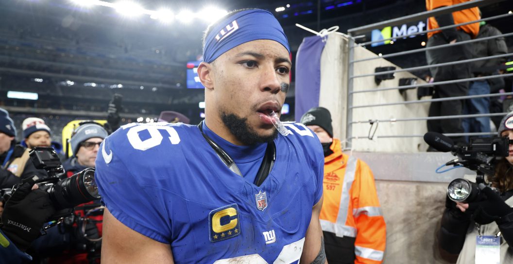 EAST RUTHERFORD, NEW JERSEY - JANUARY 07: Saquon Barkley #26 of the New York Giants walks off the field after a win over the Philadelphia Eagles at MetLife Stadium on January 07, 2024 in East Rutherford, New Jersey.