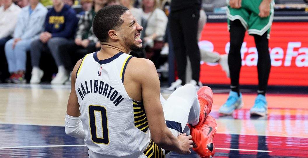 INDIANAPOLIS, INDIANA - JANUARY 08: Tyrese Haliburton #0 of the Indiana Pacers grimaces after injuring his leg in the first half against the Boston Celtics at Gainbridge Fieldhouse on January 08, 2024 in Indianapolis, Indiana. NOTE TO USER: User expressly acknowledges and agrees that, by downloading and or using this photograph, User is consenting to the terms and conditions of the Getty Images License