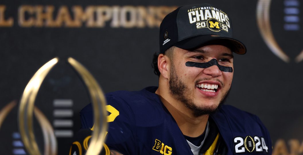 HOUSTON, TEXAS - JANUARY 08: Blake Corum #2 of the Michigan Wolverines reacts during the press conference after defeating the was during the 2024 CFP National Championship game at NRG Stadium on January 08, 2024 in Houston, Texas. Michigan defeated Washington 34-13.