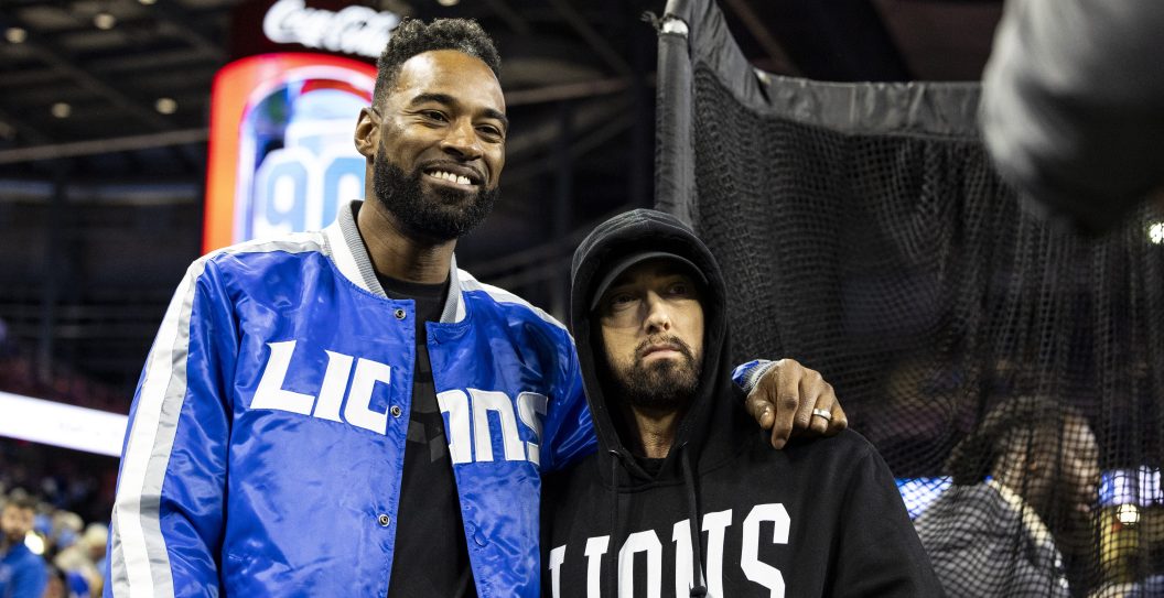 DETROIT, MICHIGAN - JANUARY 14: Former Detroit Lions player Calvin Johnson poses for a photo with Eminem before the Lions home game against the Los Angeles Rams at Ford Field on January 14, 2024 in Detroit, Michigan. The Lions beat the Rams 24-23.