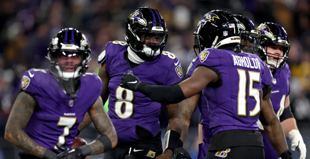 BALTIMORE, MARYLAND - JANUARY 20: Lamar Jackson #8 of the Baltimore Ravens celebrates with Nelson Agholor #15 after scoring a 15 yard touchdown against the Houston Texans during the third quarter in the AFC Divisional Playoff game at M&T Bank Stadium on January 20, 2024 in Baltimore, Maryland.