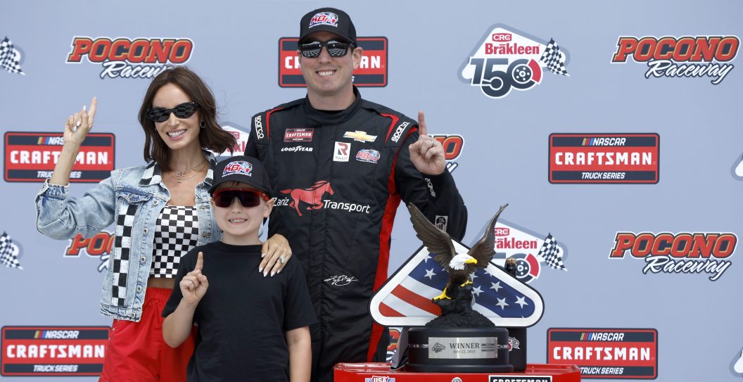 LONG POND, PENNSYLVANIA - JULY 22: Kyle Busch, driver of the #51 Zariz Transport Chevrolet, celebrates with wife, Samantha Busch, and son, Brexton Busch in victory lane after winning NASCAR Craftsman Truck Series CRC Brakleen 150 and Kyle Busch Motorsports' 100th win in the NASCAR Truck Series at Pocono Raceway on July 22, 2023 in Long Pond, Pennsylvania.