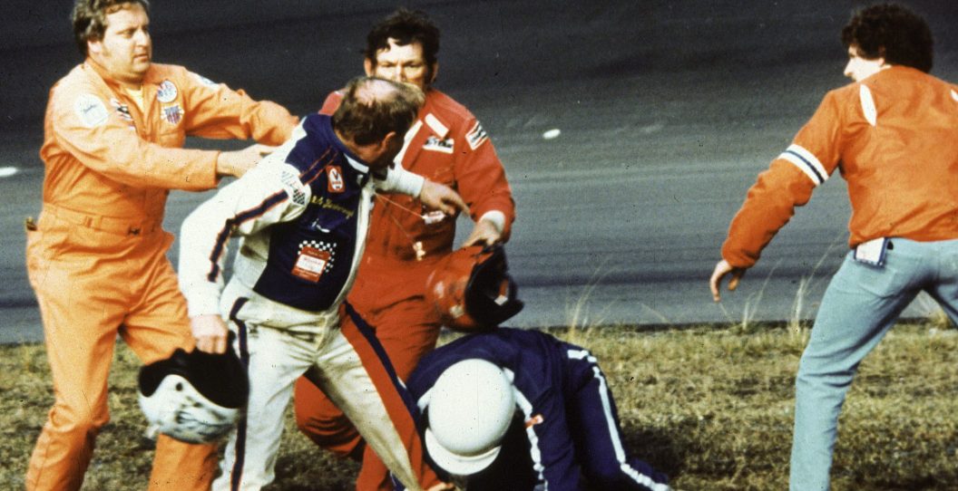 DAYTONA BEACH, FL - FEBRUARY 18, 1979: Track emergency workers try to break up a fight between Cale Yarborough, Donnie Allison and Bobby Allison after Yarborough and Donnie Allison crashed on the final lap while battling for the lead in the Daytona 500 at Daytona International Speedway. The incident happened before a live nationwide TV audience, and is said to have spiked a huge interest in ticket sales for upcoming NASCAR races that year.