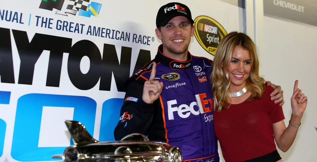 DAYTONA BEACH, FL - FEBRUARY 21: Denny Hamlin, driver of the #11 FedEx Express Toyota, celebrates in Victory Lane with his wife, Jordan Fish after winning the NASCAR Sprint Cup Series DAYTONA 500 at Daytona International Speedway on February 21, 2016 in Daytona Beach, Florida.