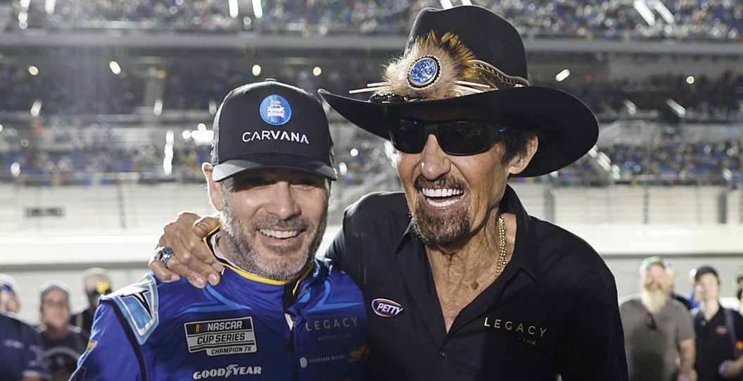 DAYTONA BEACH, FLORIDA - FEBRUARY 16: Legacy Motor Club team owners, Jimmie Johnson, driver of the #84 Carvana Chevrolet, (L) and NASCAR Hall of Famer Richard Petty pose for photos prior to the NASCAR Cup Series Bluegreen Vacations Duel #1 at Daytona International Speedway on February 16, 2023 in Daytona Beach, Florida.