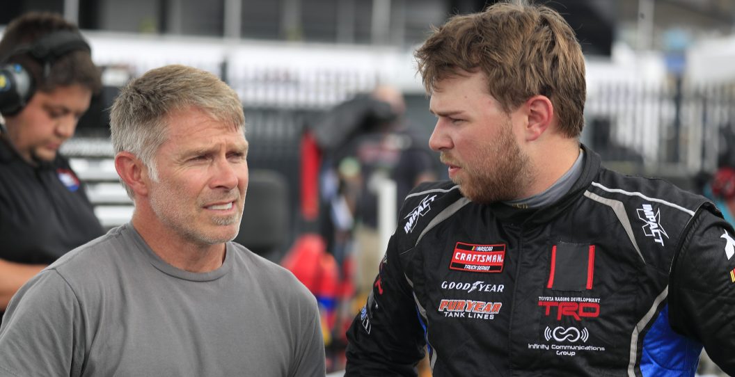 LEBANON, TN - JUNE 23: Layne Riggs (#02 Young's Motorsports Heartland Chevrolet) talks with his father former Cup driver Scott Riggs during qualifying for the NASCAR Craftsman Truck Series Rackley Roofing 200 on June 23, 2023 at Nashville SuperSpeedway in Lebanon, TN.