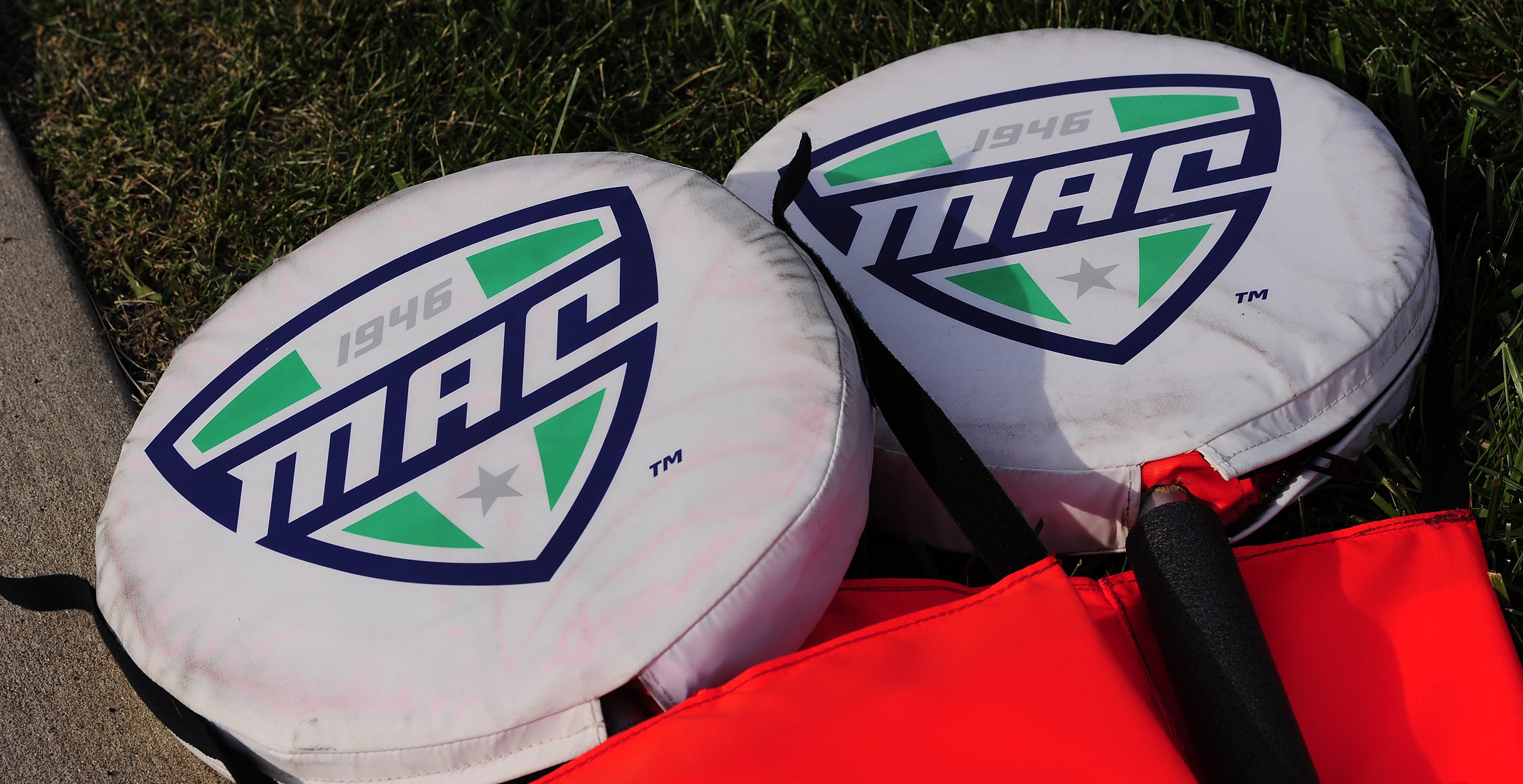 MUNCIE, IN - AUGUST 30: Mid-American Conference logos are seen on the top of the sideline signal poles before the start of the college football game between the Central Connecticut State University Blue Devils and the Ball State Cardinals on August 30, 2018, at Scheumann Stadium in Muncie, Indiana.