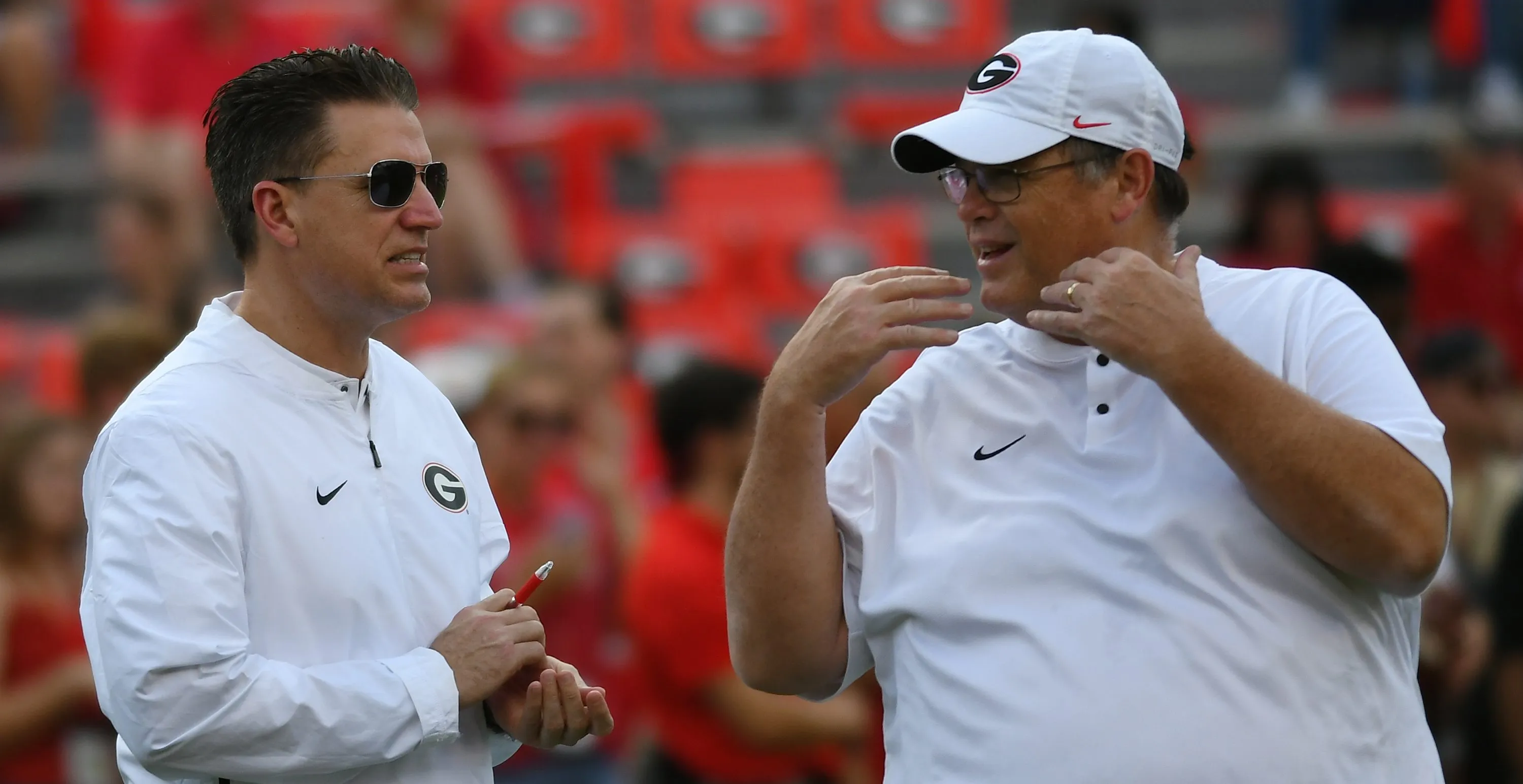 ATHENS, GA - SEPTEMBER 29: Georgia Bulldogs Quarterbacks Coach James Coley and Georgia Bulldogs Offensive Coordinator Jim Chaney talk during warmups before the game between the Tennessee Volunteers and the Georgia Bulldogs on September 29, 2018, at Sanford Stadium in Athens, GA. Georgia defeated Tennessee 38-12.