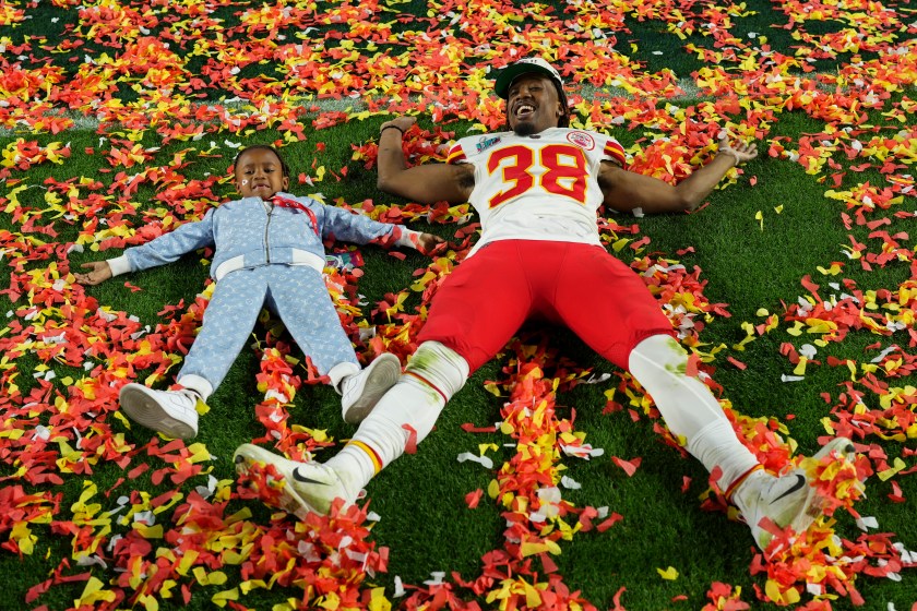 L'Jarius Sneed celebrates with his son after winning the Super Bowl.