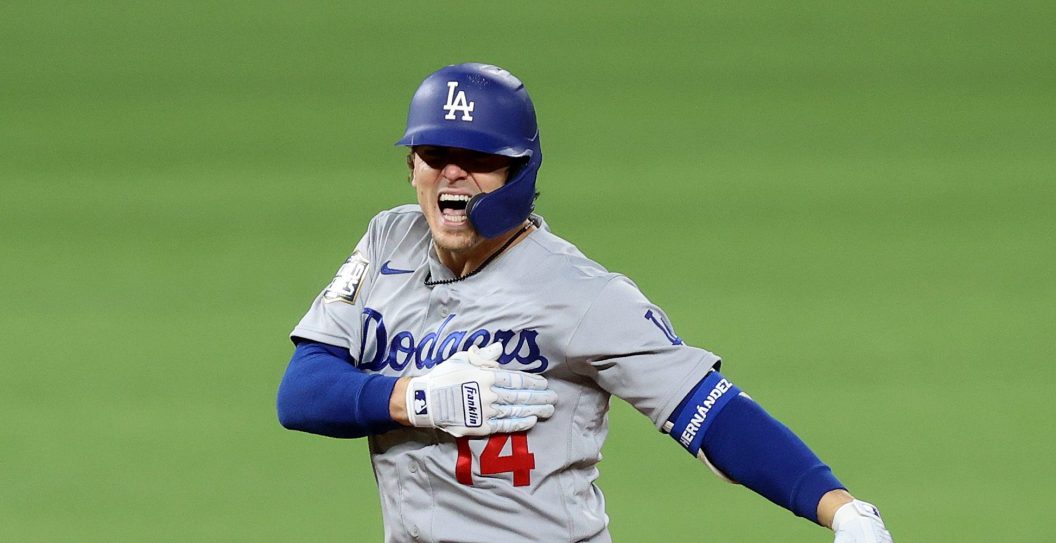 ARLINGTON, TEXAS - OCTOBER 24: Enrique Hernandez #14 of the Los Angeles Dodgers celebrates after hitting an RBI double against the Tampa Bay Rays during the sixth inning in Game Four of the 2020 MLB World Series at Globe Life Field on October 24, 2020 in Arlington, Texas.