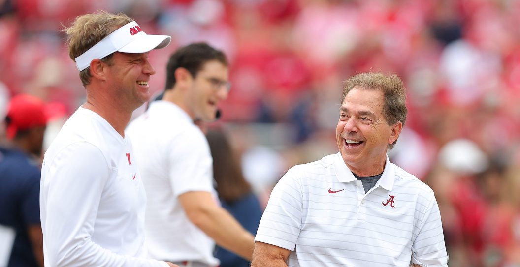 TUSCALOOSA, ALABAMA - OCTOBER 02: Head coach Nick Saban of the Alabama Crimson Tide converses with head coach Lane Kiffin of the Mississippi Rebels prior to facing each other at Bryant-Denny Stadium on October 02, 2021 in Tuscaloosa, Alabama.