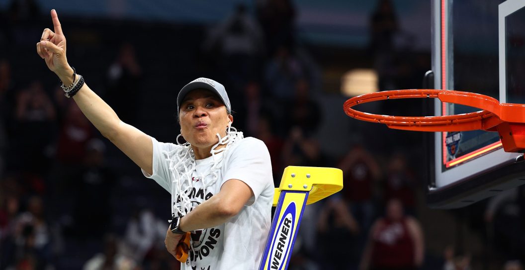 MINNEAPOLIS, MINNESOTA - APRIL 03: Head coach Dawn Staley of the South Carolina Gamecocks reacts after cutting down the net after defeating the UConn Huskies 64-49 during the 2022 NCAA Women's Basketball Tournament National Championship game at Target Center on April 03, 2022 in Minneapolis, Minnesota.