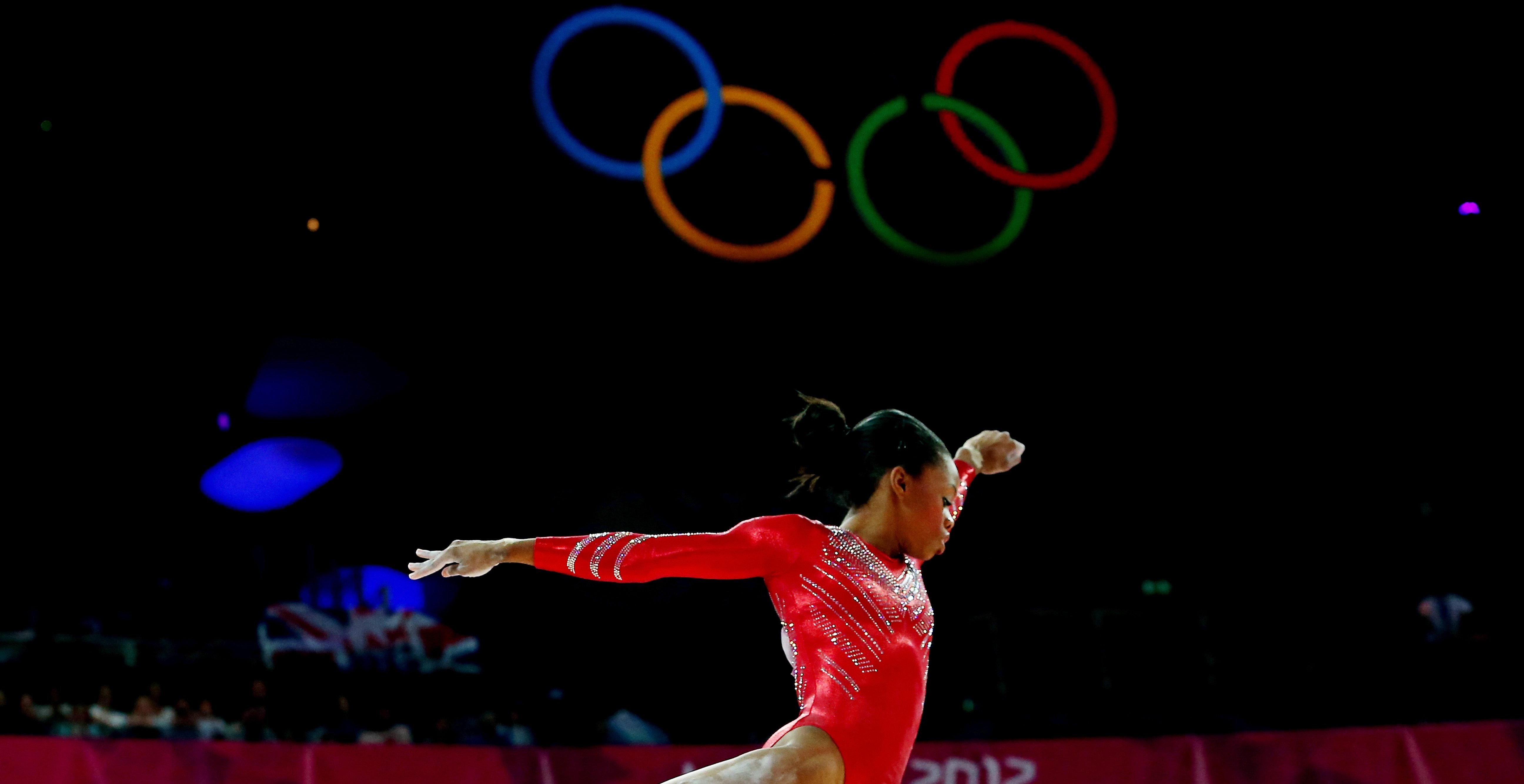 LONDON, ENGLAND - JULY 31: Gabrielle Douglas of the United States of America competes on the balance beam in the Artistic Gymnastics Women's Team final on Day 4 of the London 2012 Olympic Games at North Greenwich Arena on July 31, 2012 in London, England.