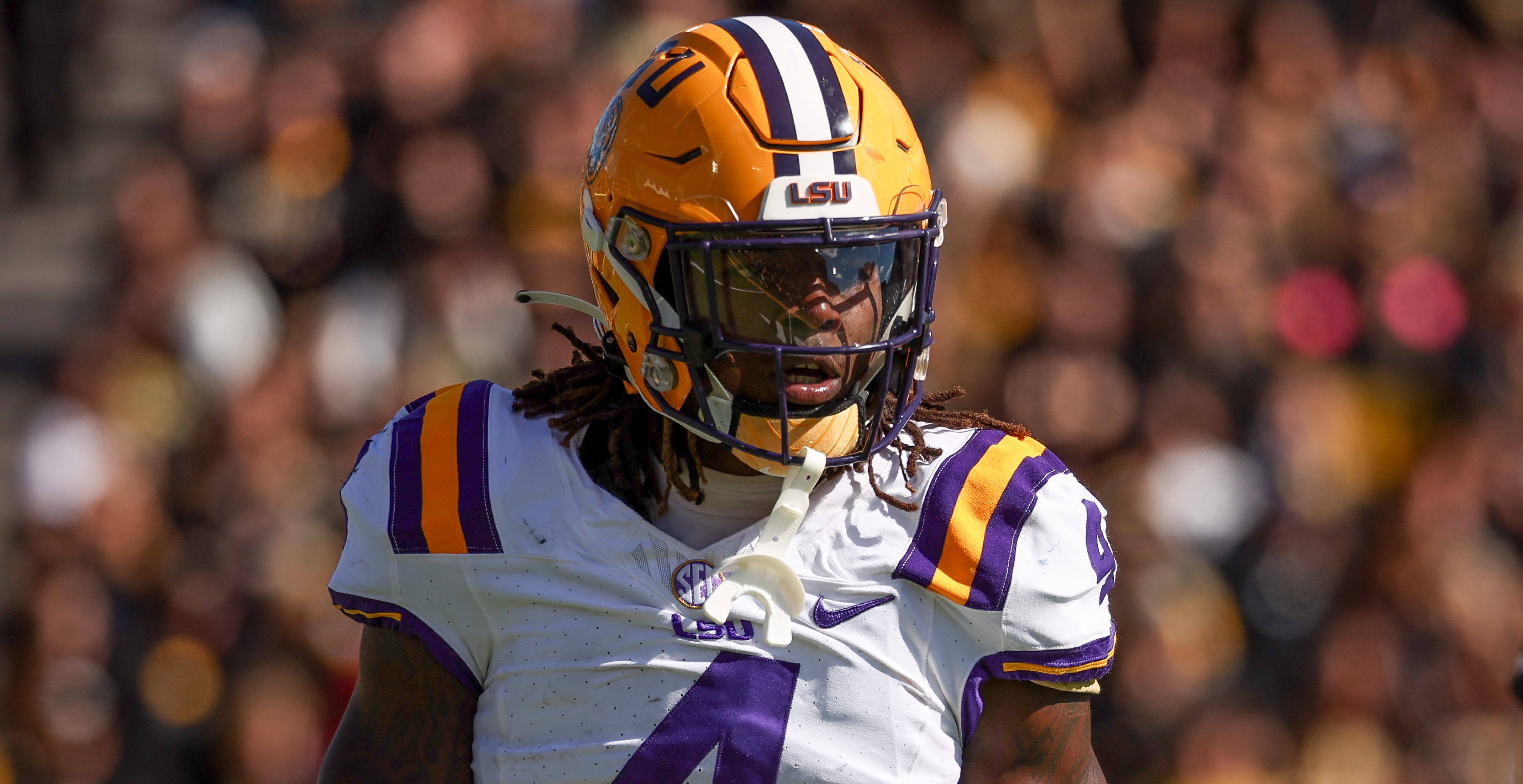 COLUMBIA, MO - OCTOBER 07: LSU Tigers linebacker Harold Perkins Jr. (4) flexes after a stop in the fourth quarter of an SEC football game between the LSU Tigers and Missouri Tigers on Oct 7, 2023 at Memorial Stadium in Columbia, MO.