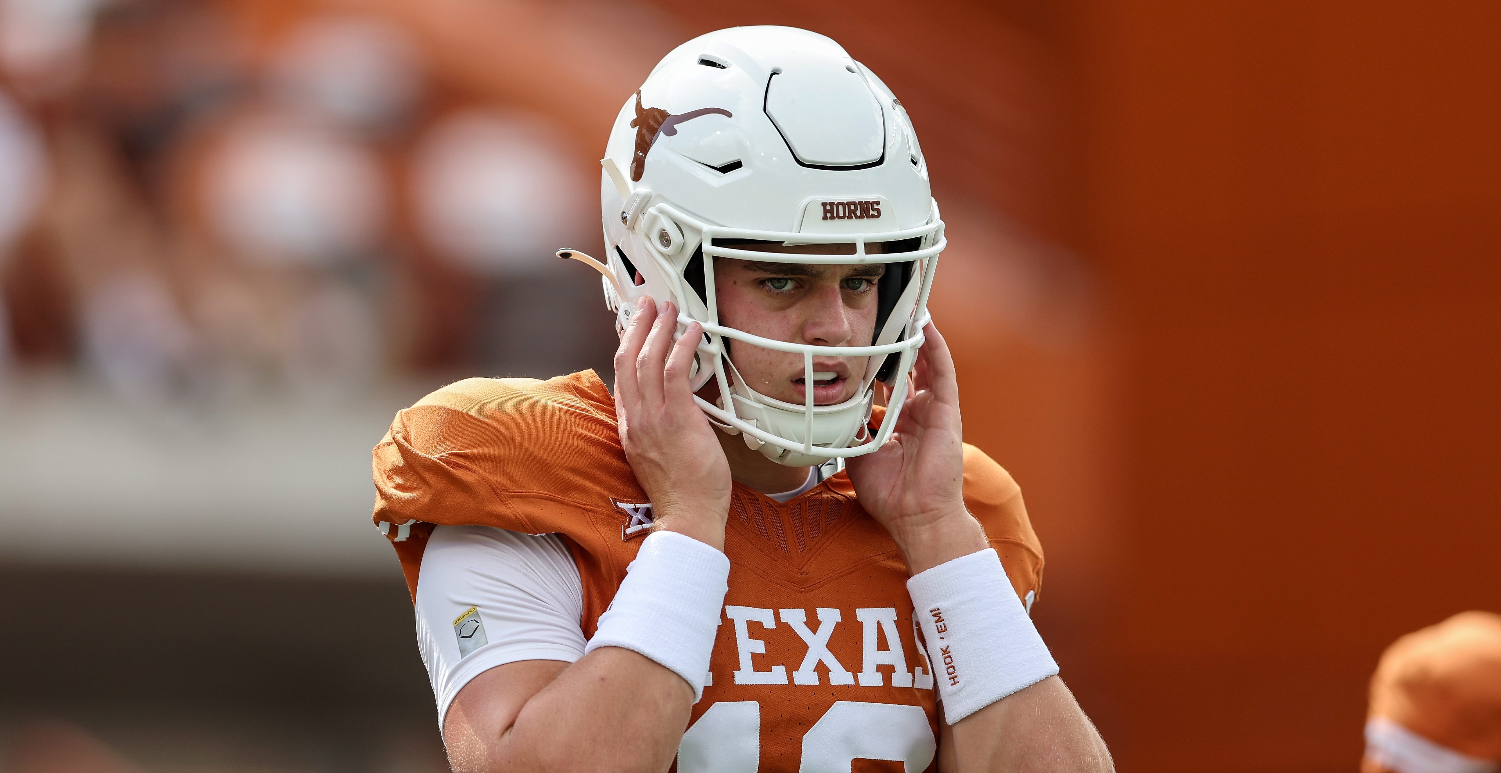 AUSTIN, TEXAS - OCTOBER 28: Arch Manning #16 of the Texas Longhorns warms up before the game against the Brigham Young Cougars at Darrell K Royal-Texas Memorial Stadium on October 28, 2023 in Austin, Texas.