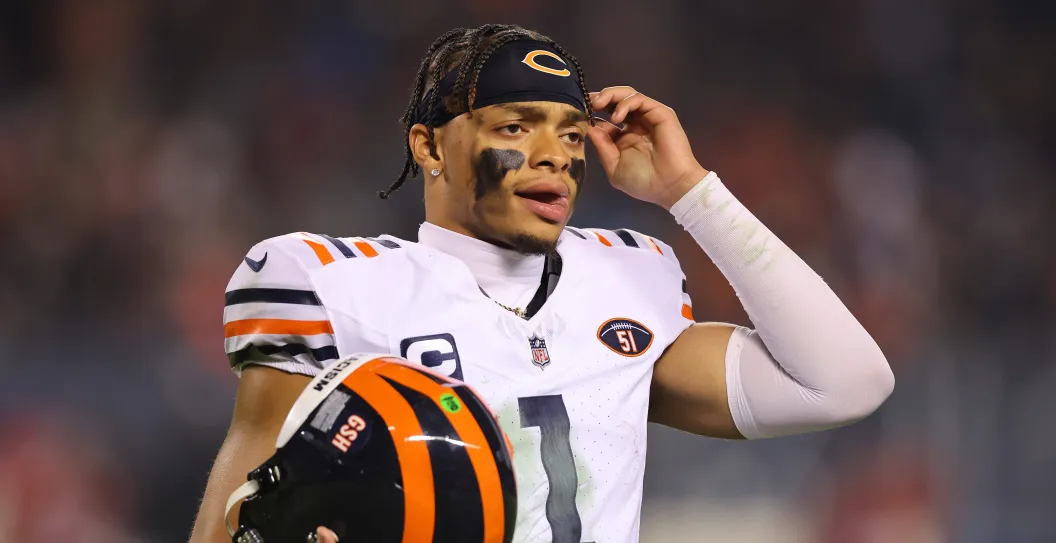 CHICAGO, ILLINOIS - DECEMBER 24: Justin Fields #1 of the Chicago Bears reacts against the Arizona Cardinals at Soldier Field on December 24, 2023 in Chicago, Illinois.